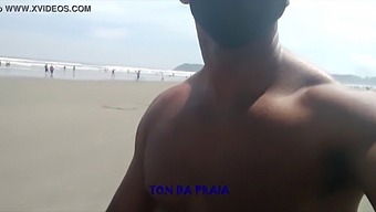 Lots Of People Walking On The Beach In The Morning